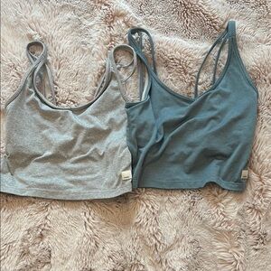 Women’s Vuori sports bras both size small . One blue and one grey